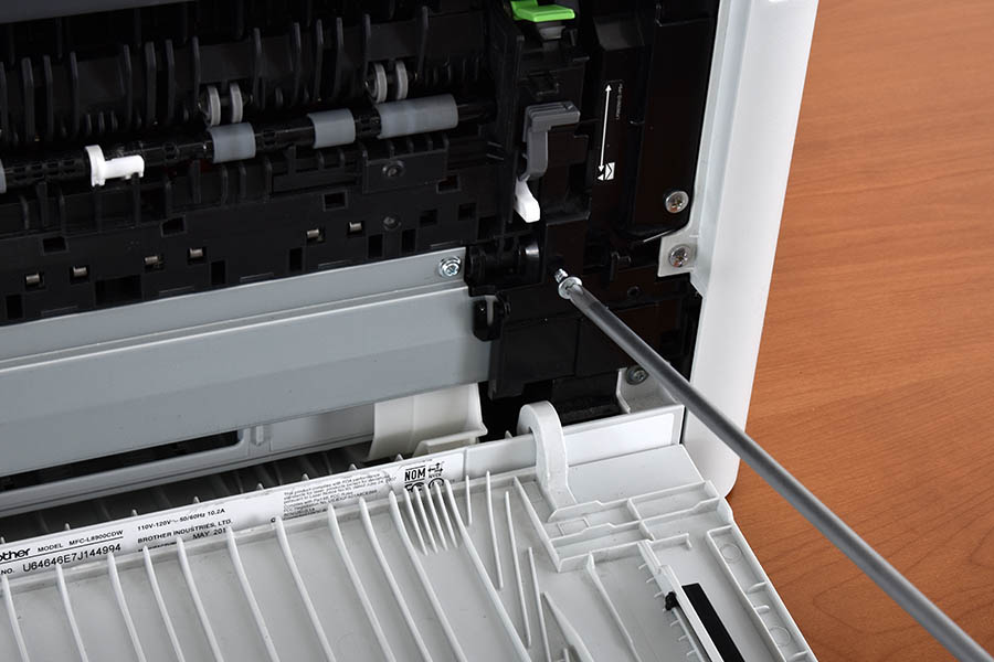 Remove right fuser cover lower screw