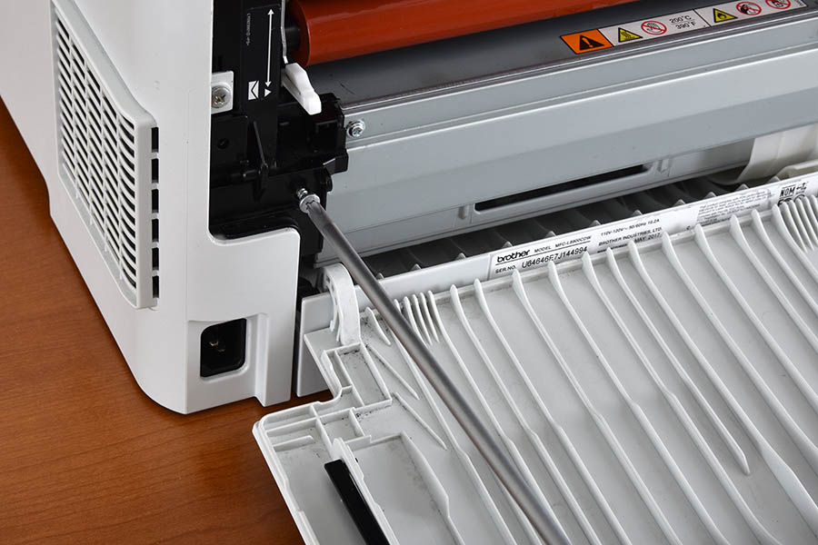 Remove left fuser cover lower screw