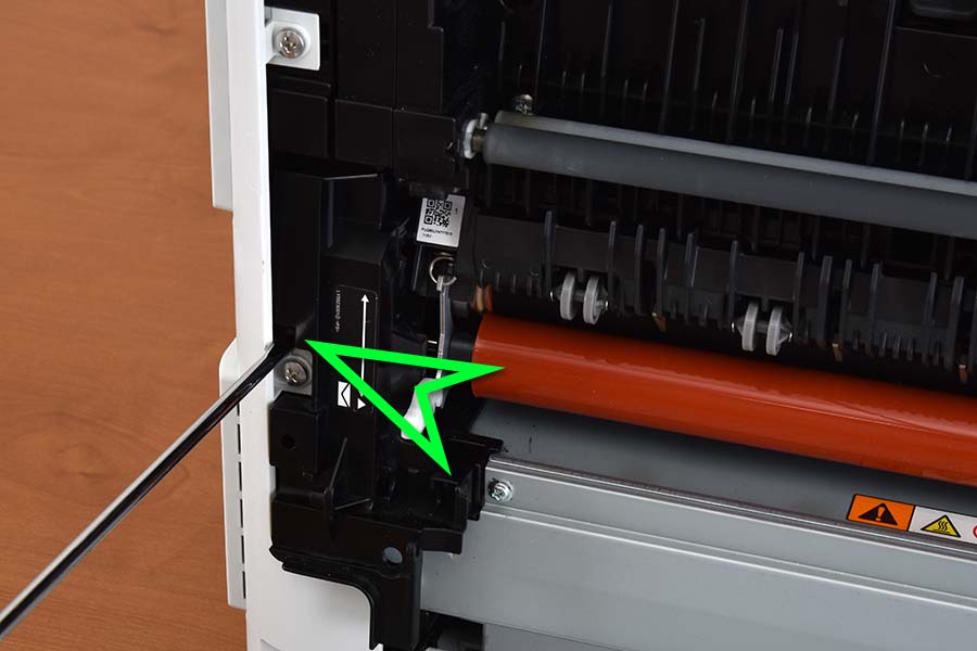 Remove left fuser cover release tab