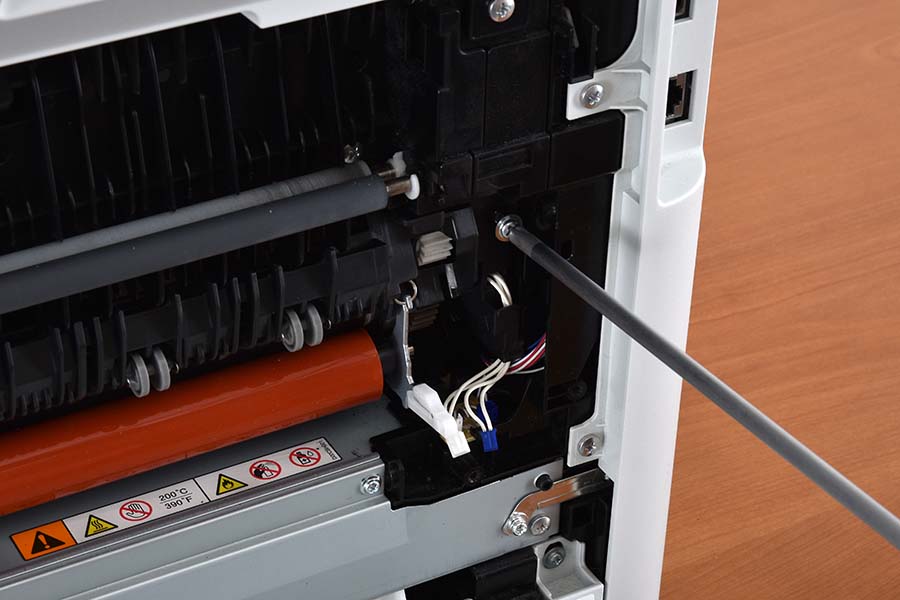 Remove fuser assembly right screw